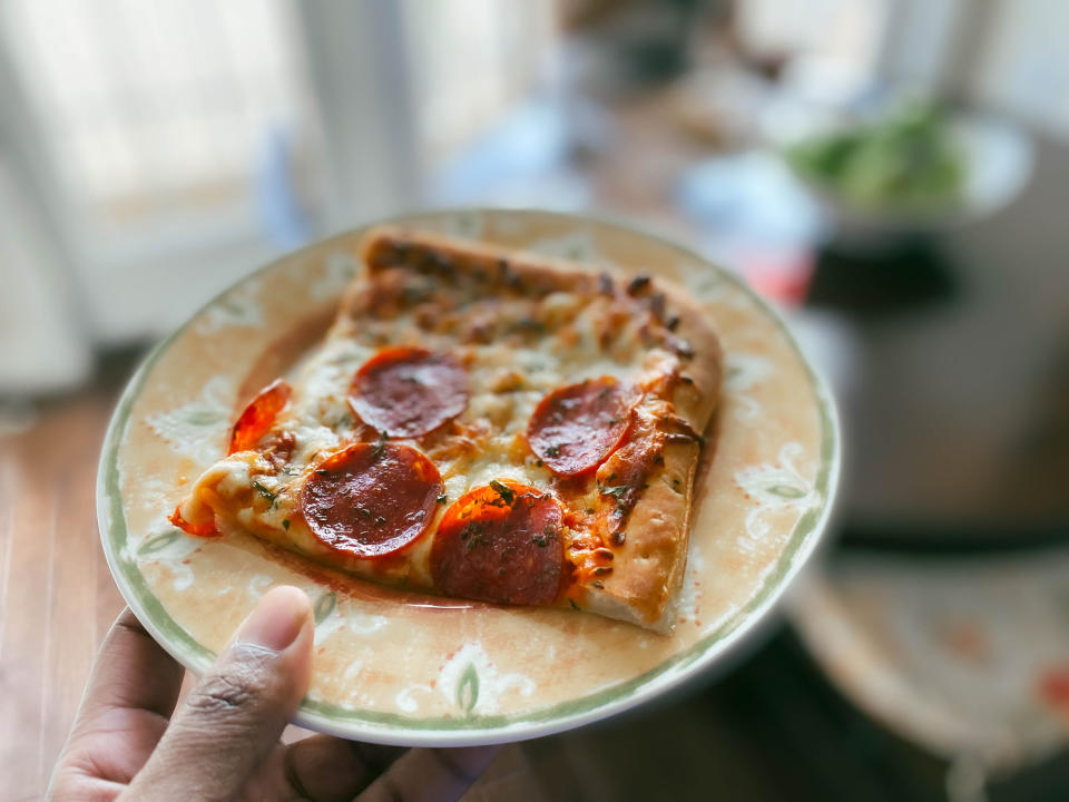 A piece of pepperoni pizza.