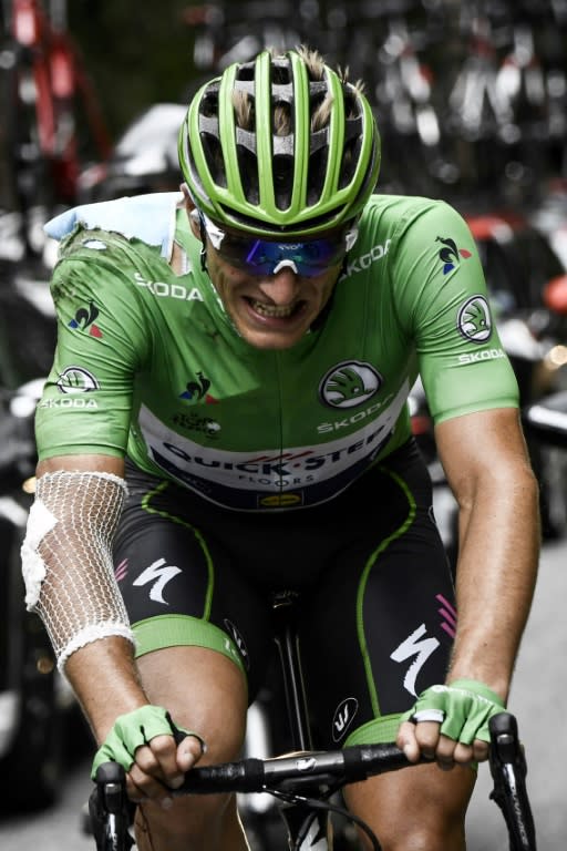 Germany's Marcel Kittel wearing the 'best sprinter' green jersey, injured after falling, rides during the 183km 17th stage of the 104th edition of the Tour de France cycling race, between Le La Mure and Serre-Chevalier, on July 19, 2017