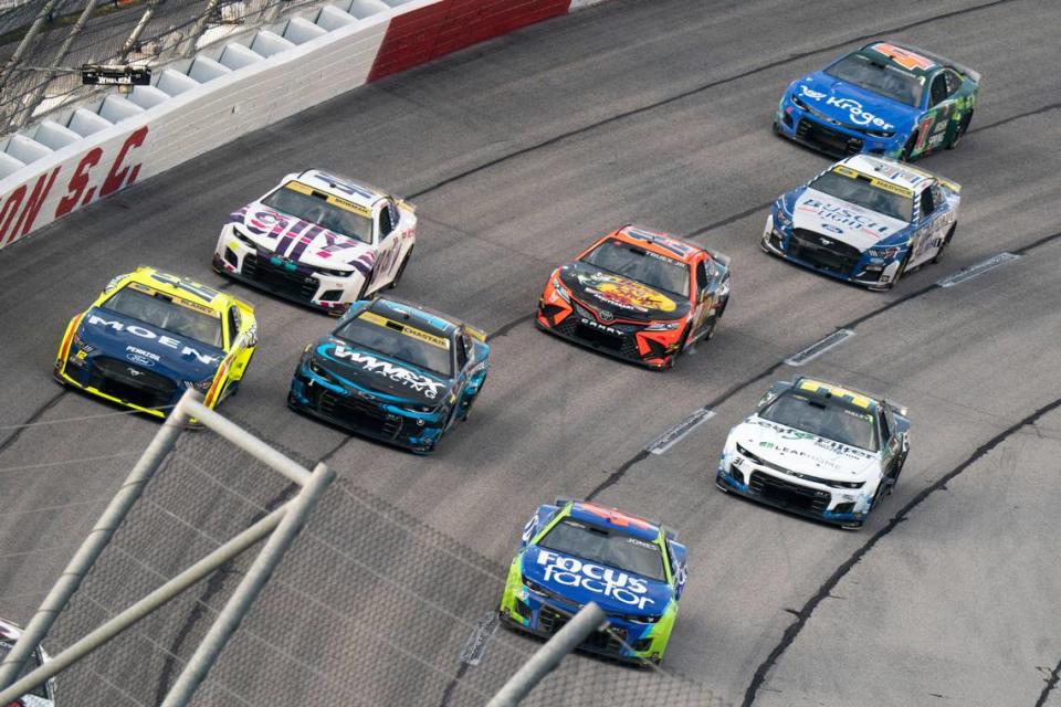 Erik Jones (43), Ross Chastain (1), Ryan Blaney (12), Alex Bowman (48), Martin Truex (19), Kevin Harvick (4) and Ricky Stenhouse Jr. (47) compete in the NASCAR Southern 500 auto race Sunday, Sept. 4, 2022, in Darlington, S.C. Jones won the race after taking the lead from Kyle Busch when Busch blew a motor with 30 laps remaining in the race. (AP Photo/Sean Rayford) Sean Rayford/AP