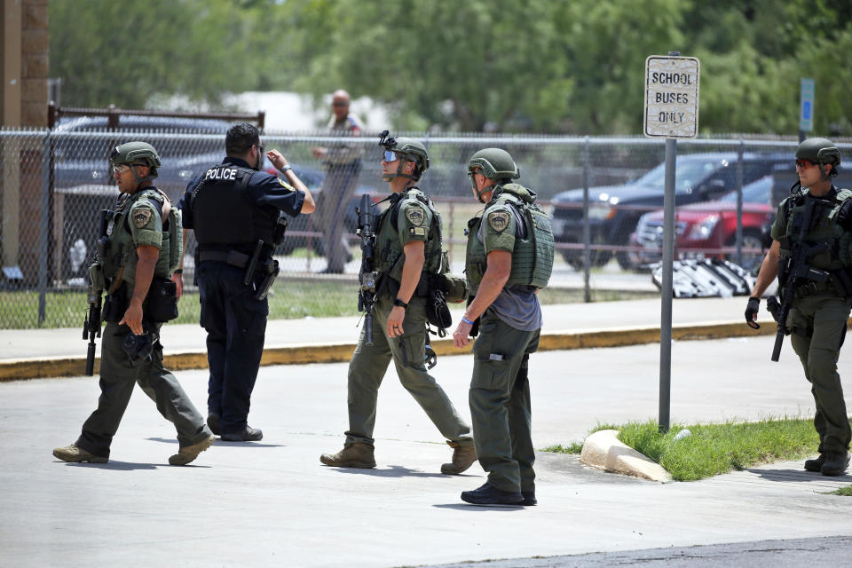 Law enforcement personnel stand outside Robb Elementary School (Dario Lopez-Mills / AP)