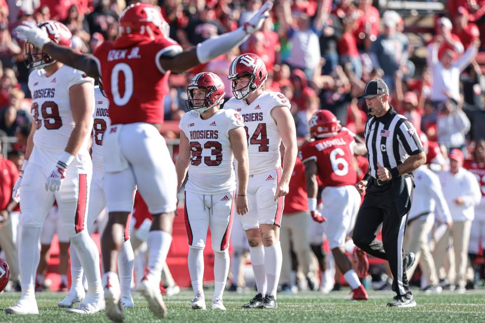 Oct 22, 2022; Piscataway, New Jersey, USA;  Indiana Hoosiers place kicker Charles Campbell (93) reacts after missing a field goal in front of Rutgers Scarlet Knights defensive back Christian Izien (0) during the second half at SHI Stadium. M