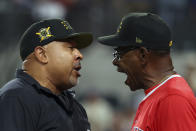 Third base umpire Adrian Johnson and Los Angeles Angels manager Ron Washington (37) have words in the 13th inning of a baseball game Saturday, May 18, 2024, in Arlington, Texas. (AP Photo/Richard W. Rodriguez)