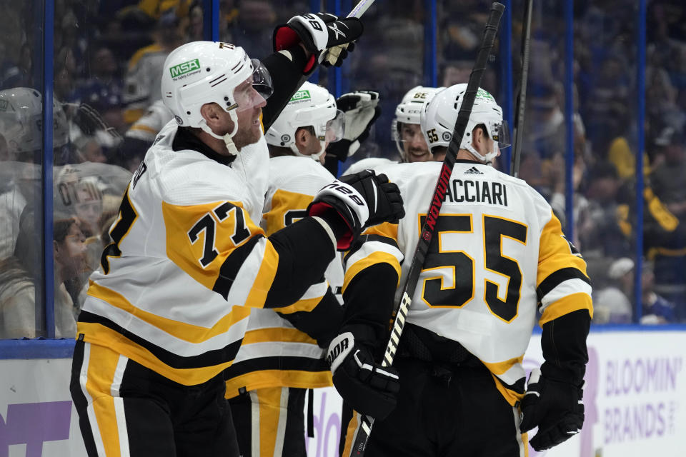 Pittsburgh Penguins center Jeff Carter (77) celebrates his goal against the Tampa Bay Lightning during the third period of an NHL hockey game Thursday, Nov. 30, 2023, in Tampa, Fla. (AP Photo/Chris O'Meara)