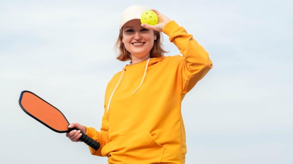 Woman playing pickleball as a natural GLP-1 alternative