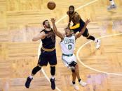 May 25, 2017; Boston, MA, USA; Boston Celtics guard Avery Bradley (0) and Cleveland Cavaliers forward Kevin Love (0) reach for a loose ball during the third quarter of game five of the Eastern conference finals of the NBA Playoffs at TD Garden. Mandatory Credit: Bob DeChiara-USA TODAY Sports