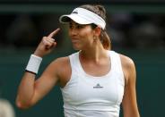 Britain Tennis - Wimbledon - All England Lawn Tennis & Croquet Club, Wimbledon, England - 27/6/16 Spain's Garbine Muguruza celebrates winning her match against Italy's Camila Giorgi REUTERS/Paul Childs