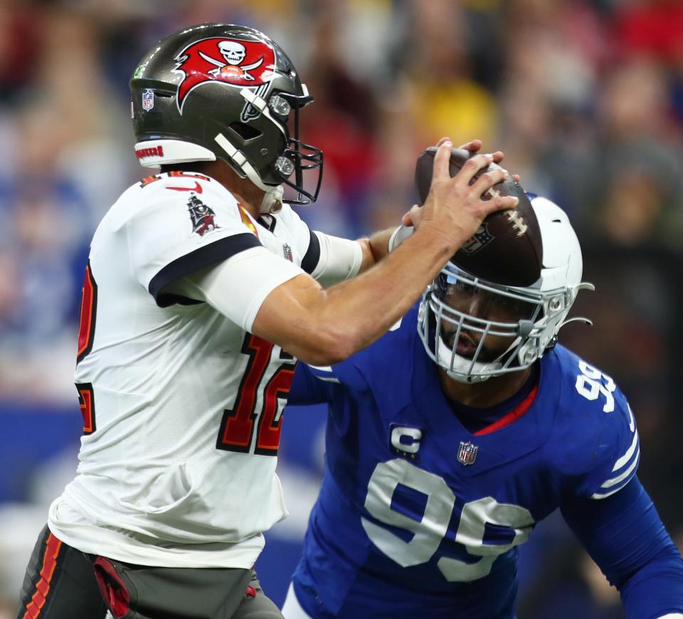 Indianapolis Colts defensive tackle DeForest Buckner (99) sacks Tampa Bay Buccaneers quarterback Tom Brady (12) Sunday, Nov. 28, 2021, during a game against the Tampa Bay Buccaneers at Lucas Oil Stadium in Indianapolis.