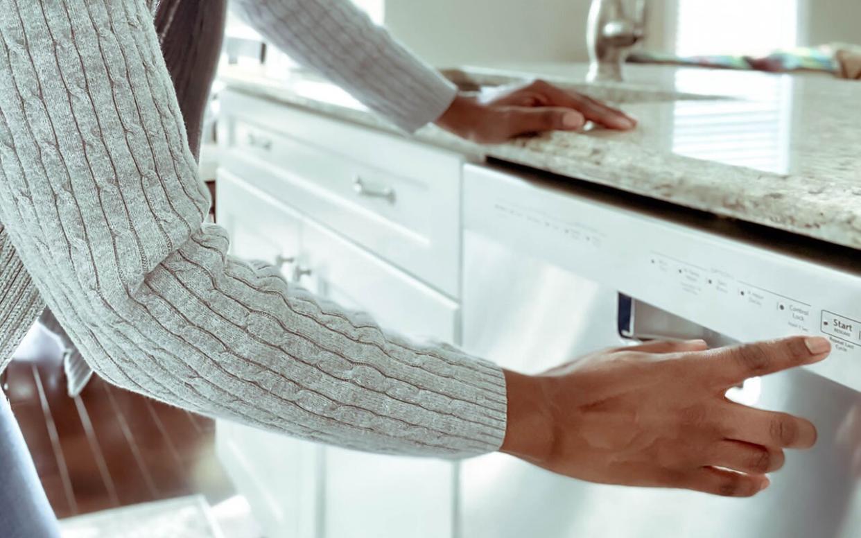 Woman Starts Dishwasher