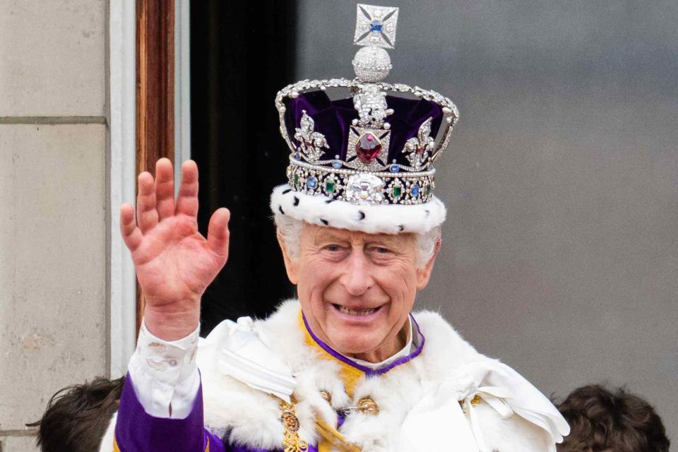 <p>Samir Hussein/WireImage</p> King Charles on the balcony of Buckingham Palace following the coronation on May 6, 2023..