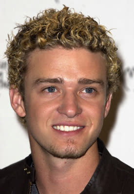 <p>The sexy 'Suit and Tie' singer wasn't always as perfectly groomed as he is now. Back in his Nsync days he continually had super curly hair with bleached tips.</p>