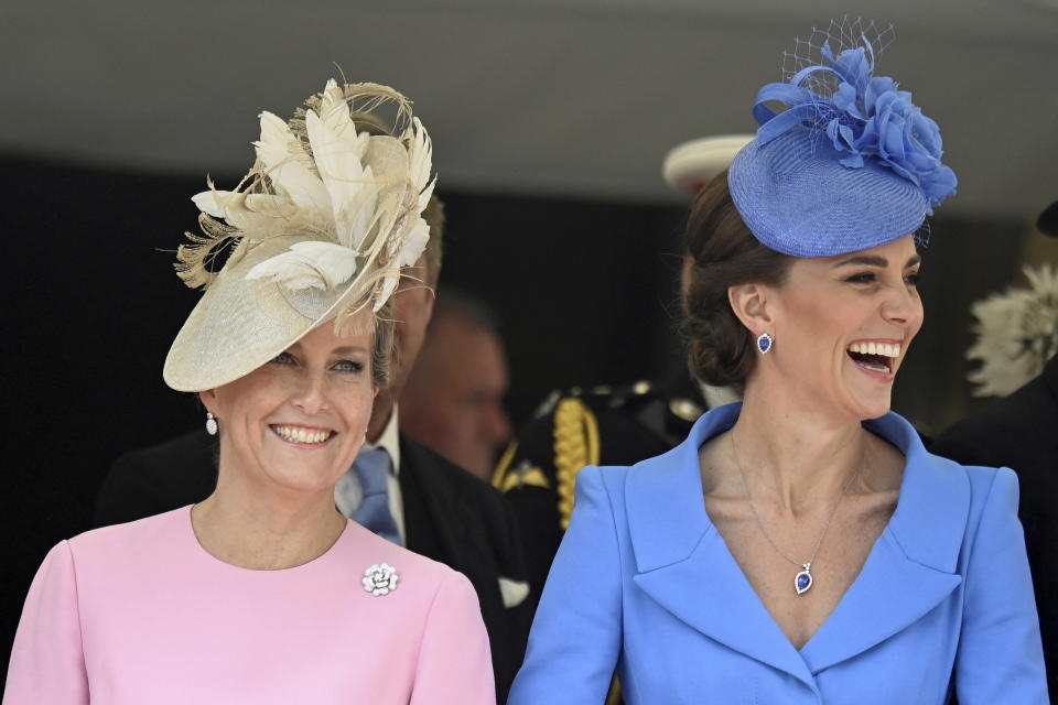 Britain's Sophie, Countess of Wessex, left, and Kate, Duchess of Cambridge arrive for the Order of the Garter service at Windsor Castle, in Windsor, England, Monday, June 13, 2022. The Order of the Garter is the oldest and most senior Order of Chivalry in Britain, established by King Edward III nearly 700 years ago. This year Prince Charles' wife Camilla, the Duchess of Cornwall, former British Prime Minister Tony Blair and former leader of the British House of Lords Baroness Amos were all installed in the Order. (Toby Melville/Pool via AP)