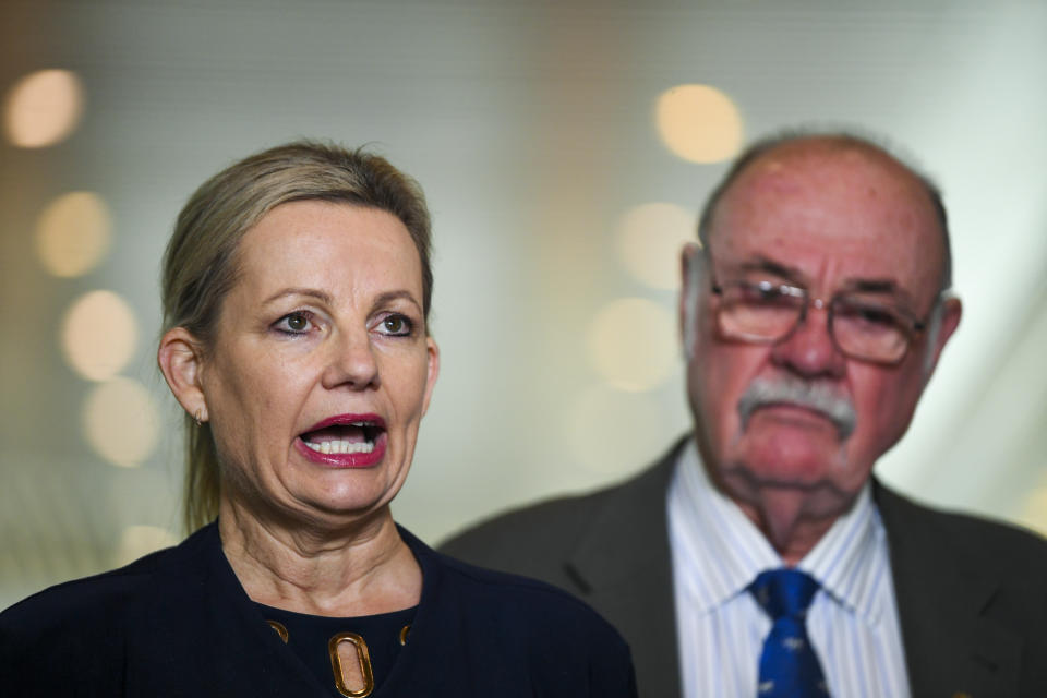 Australian Environment Minister Sussan Ley, left, speaks to the media during a press conference at Parliament House in Canberra, Tuesday, June 22, 2021. Australia said on Tuesday it will fight a draft recommendation to list the Great Barrier Reef as a World Heritage site in danger after a United Nations body called for more government action on climate change. (Lukas Coch/AAP via AP)