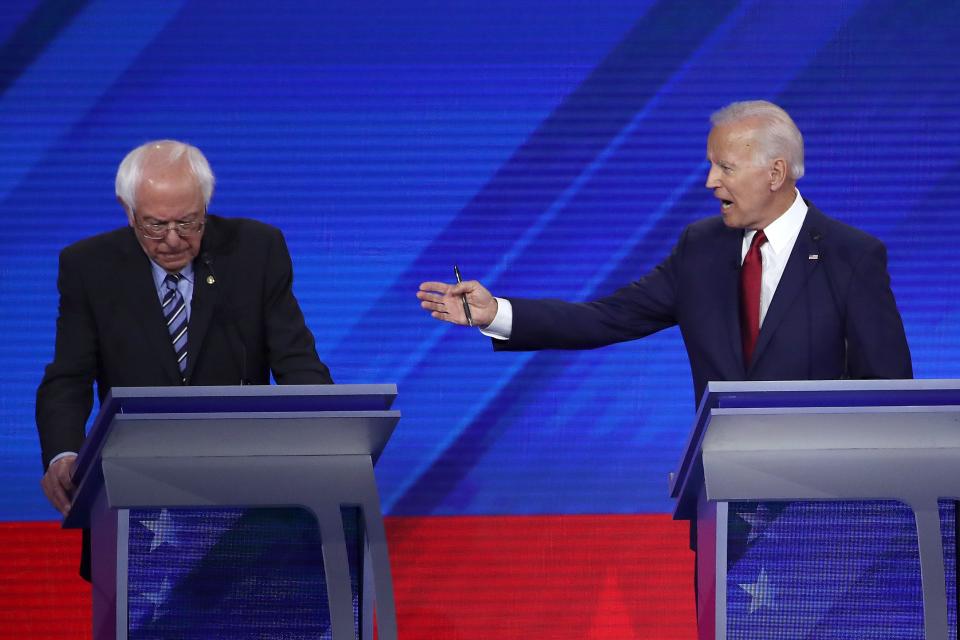  Democratic presidential candidates Sen. Bernie Sanders (I-VT) and former Vice President Joe Biden interact during the Democratic Presidential Debate at Texas Southern University's Health and PE Center on Sept. 12, 2019 in Houston, Texas. 