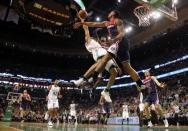 Apr 30, 2017; Boston, MA, USA; Boston Celtics guard Avery Bradley (0) tries to get to the basket between Washington Wizards guard Bradley Beal (3) and guard John Wall (2) during the second half of the Boston Celtics 123-111 win over the Washington Wizards in game one of the second round of the 2017 NBA Playoffs at TD Garden. Mandatory Credit: Winslow Townson-USA TODAY Sports