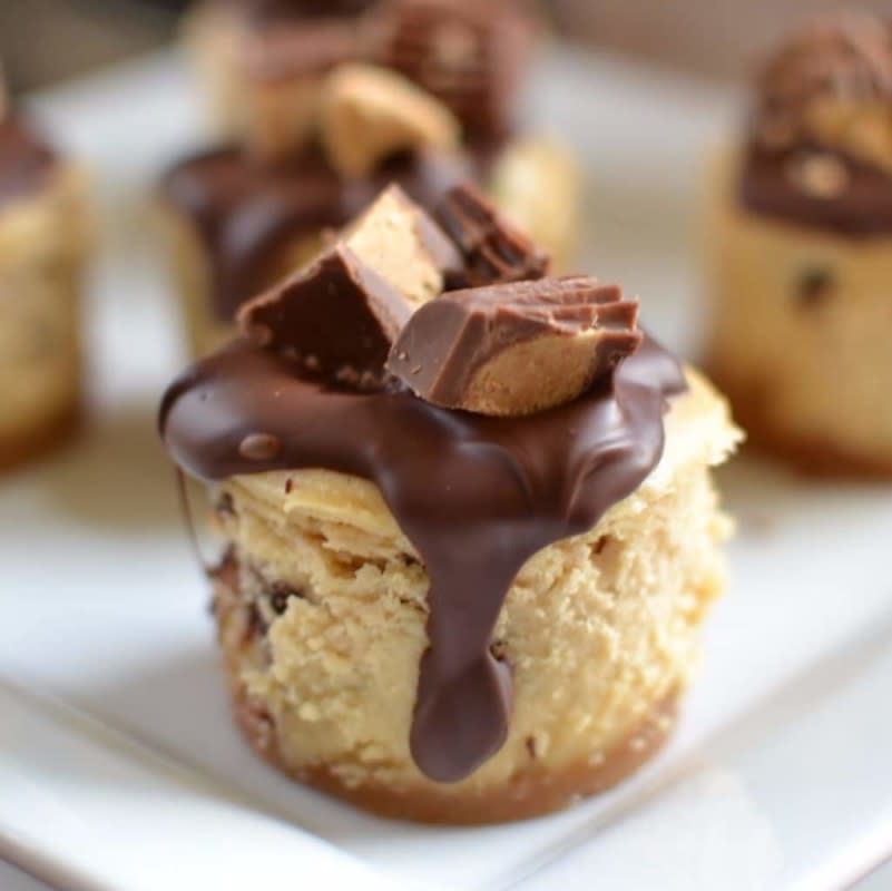 <p>Small Town Woman</p><p>These mini peanut butter cheesecakes are topped with a drop of delicious Ghirardelli chocolate and Reese’s mini peanut butter cups.</p><p><strong>Get the recipe: <a href="https://www.smalltownwoman.com/mini-peanut-butter-cheesecakes/" rel="nofollow noopener" target="_blank" data-ylk="slk:Mini Peanut Butter Cheesecakes;elm:context_link;itc:0;sec:content-canvas" class="link ">Mini Peanut Butter Cheesecakes</a></strong></p>