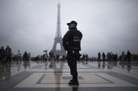 <p>A French police officer patrols at Trocadero plaza with the Eiffel Tower in the background in Paris, France, May 6, 2017. Voting for France’s next president starts in overseas territories and French embassies abroad, as a blackout on campaigning descends so that voters can reflect on whether to entrust their country’s future to independent Emmanuel Macron or far-right populist Marine Le Pen. (Photo: Kamil Zihnioglu/AP) </p>