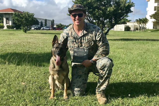 <p>Courtesy of Dalton Stone/American Humane</p> Dalton Stone with his canine partner Aida while serving overseas in Japan