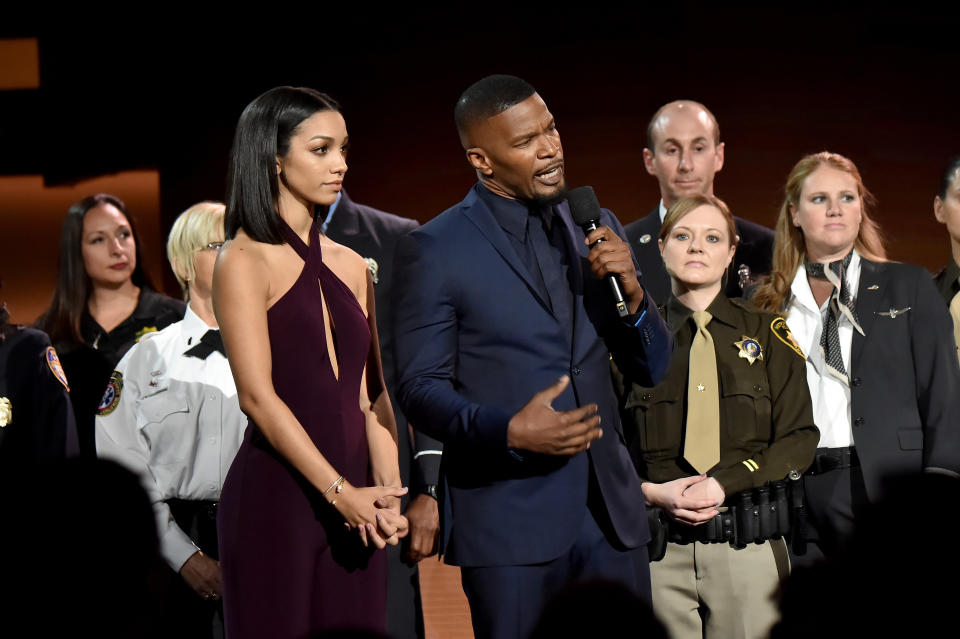 LOS ANGELES, CA - NOVEMBER 19:  Corinne Foxx (L) and Jamie Foxx speak onstage during the 2017 American Music Awards at Microsoft Theater on November 19, 2017 in Los Angeles, California.  (Photo by Jeff Kravitz/AMA2017/FilmMagic for dcp)