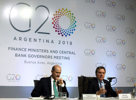 Argentina's Treasury Minister Nicolas Dujovne (R) speaks next to Argentina's Central Bank President Federico Sturzenegger during a news conference at the G20 Meeting of Finance Ministers in Buenos Aires, Argentina, March 20, 2018. REUTERS/Marcos Brindicci