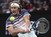 Germany's Alexander Zverev makes a backhand return to Russia's Andrey Rublev during their fourth round singles match at the Australian Open tennis championship in Melbourne, Australia, Monday, Jan. 27, 2020. (AP Photo/Dita Alangkara)