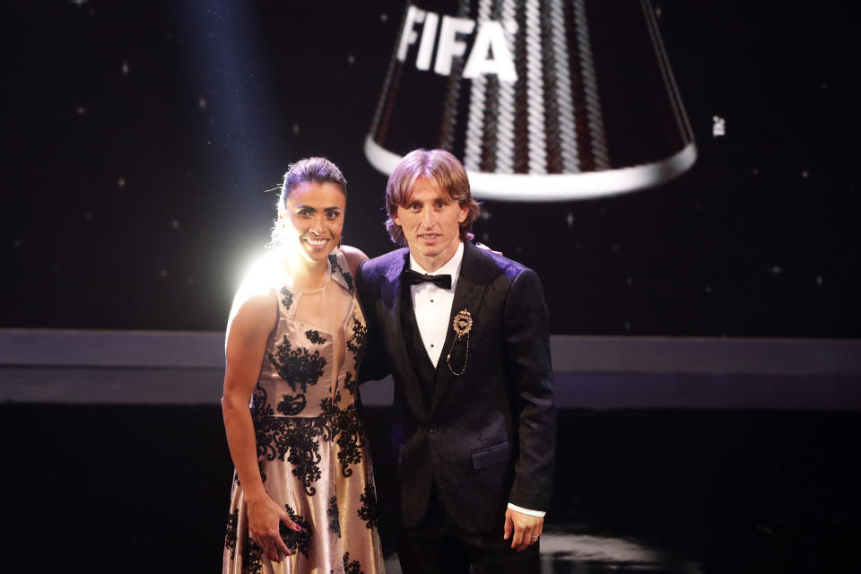 Brazil's Marta, left, who received the Best FIFA Women's player award and Croatia's Luka Modric who received the Best FIFA Men's Player award, pose during the ceremony of the Best FIFA Football Awards in the Royal Festival Hall in London, Britain, Monday, Sept. 24, 2018. (AP Photo/Frank Augstein)