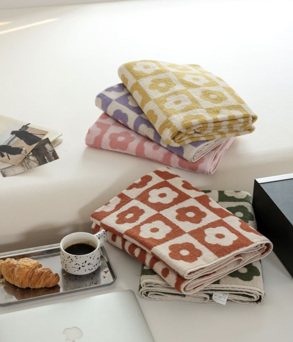 Floral Checkered Soft Breathable Cotton Towel on desk with croissant and cup of coffee (photo via Etsy)