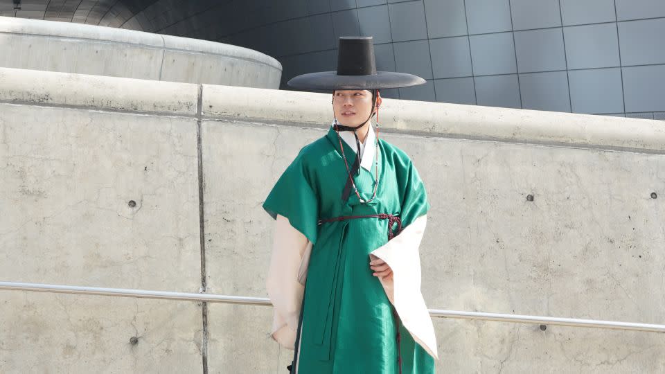 An attendee wearing traditional Korean clothing, or hanbok - Kahyun Lee/CNN