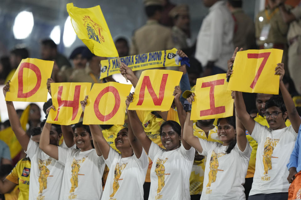 Chennai Super Kings' MS Dhoni's fans hold placards during the Indian Premier League cricket match between Sunrisers Hyderabad and Chennai Super Kings in Hyderabad, India, Friday, April 5, 2024. (AP Photo/Mahesh Kumar A.)