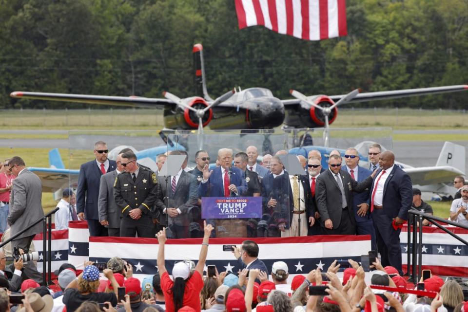 North Carolina Lieutenant Governor Mark Robinson (far right) appears onstage as former U.S. President Donald Trump speaks at the North Carolina Aviation Museum & Hall of Fame in Asheboro last month.