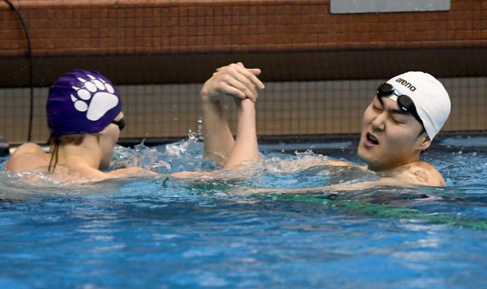 Jackson’s Holden Nist and Daniel Ham at the finish of Boys 200 Yard freestyle in Northeast Division I District Championship at Cleveland State University Saturday, February 17, 2024.