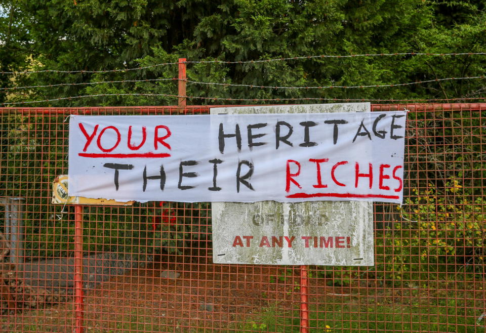 A banner is shown as part of a demonstration. (SWNS)