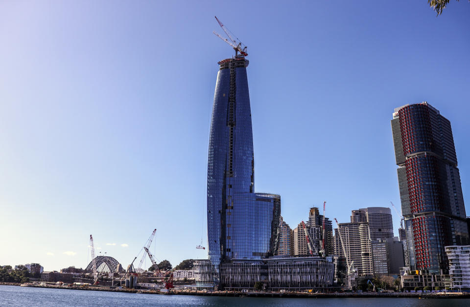 SYDNEY, AUSTRALIA - JULY 21: A Marr contracting crane is dismantled atop the new Crown Sydney tower at Barangaroo on July 21, 2020 in Sydney, Australia. A highly-skilled team of riggers from Sydney crane company Marr Contracting (The Men from Marr's) worked 300m above Sydney to remove the crane that has been perched above Crown Sydney for the past two years. Marr's specially-designed M390D crane has been climbing skywards with Crown Sydney’s 75-floor skyscraper and since the 'topping out' of the 271-metre high building, the Marr machinery has been occupying the highest vantage point in the city - approx 50m higher than the top of the tower. (Photo by James D. Morgan/Getty Images for Marr Contracting)