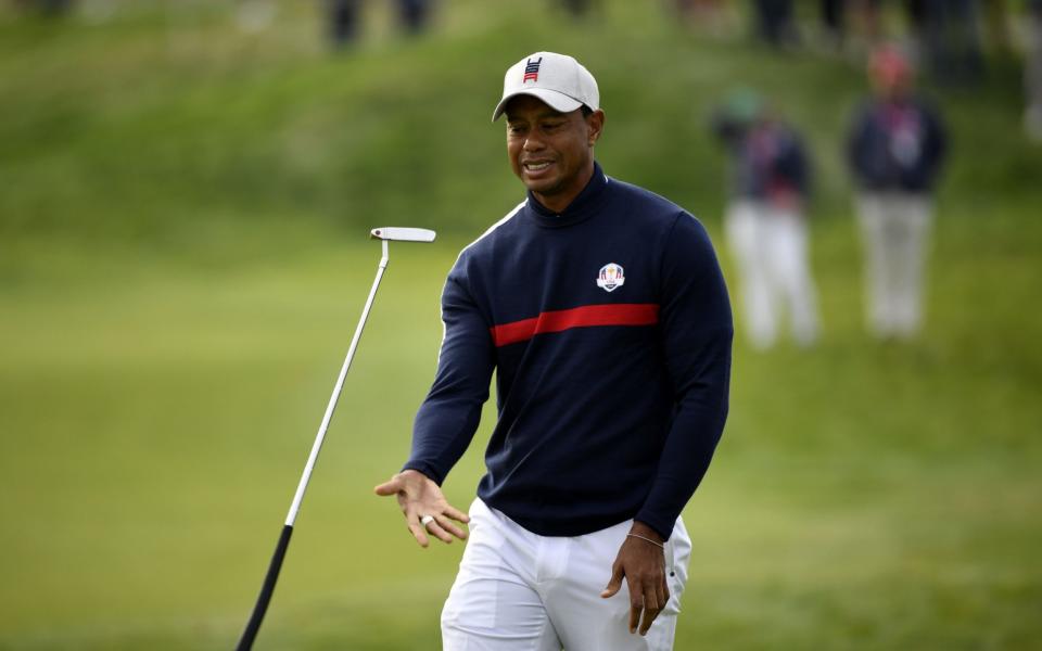 US golfer Tiger Woods juggles his putter during his fourball match on the first day of the 42nd Ryder Cup at Le Golf National Course at Saint-Quentin-en-Yvelines, south-west of Paris on September 28, 2018