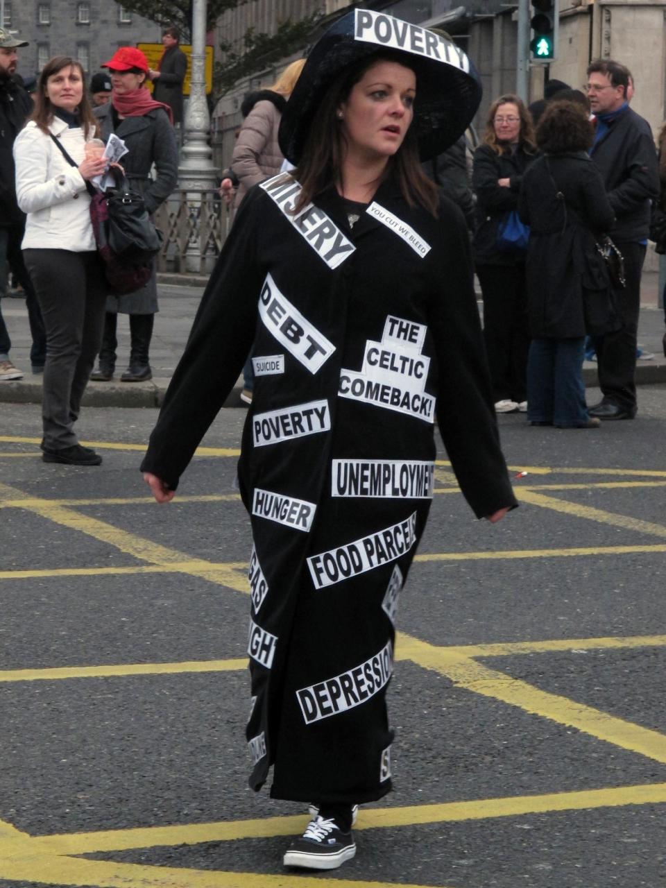 Dublin school assistant Lizzy Stringer,26, parades in a costume depicting Ireland's economic woes during an anti-austerity protest Saturday, Nov. 24, 2012. The government says it will unveil Ireland's sixth straight austerity budget next month in hopes of reducing the country's 2013 deficit to 8.6 percent, still nearly triple the spending limit that eurozone members are supposed to observe. (AP Photo/Shawn Pogatchnik)