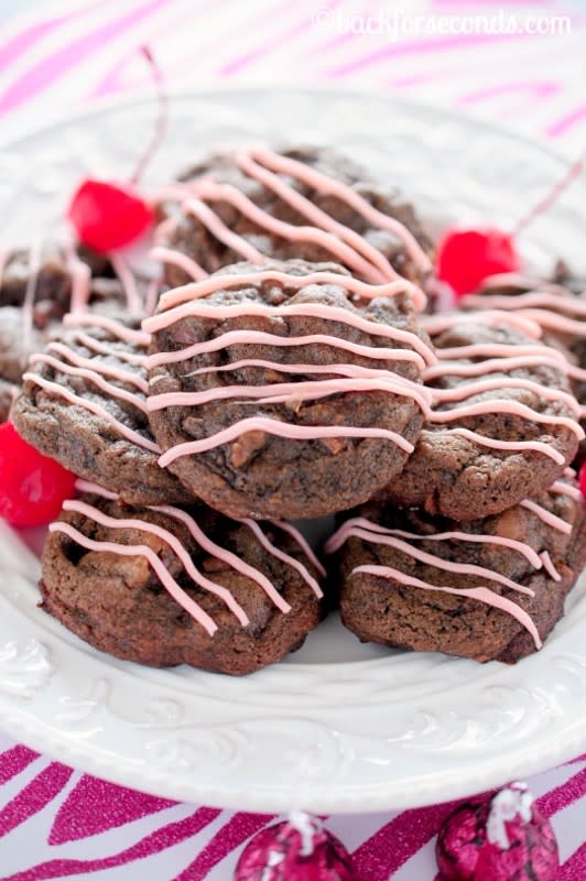 <p>Back For Seconds</p><p>Cherry Cordial Chocolate Cookies are are rich and chewy with pockets of cherry cordial kisses sprinkled throughout! Perfect for Christmas! </p><p>Get the recipe: <a href="http://backforseconds.com/cherry-cordial-chocolate-cookies/" rel="nofollow noopener" target="_blank" data-ylk="slk:Cherry Cordial Chocolate Cookies;elm:context_link;itc:0;sec:content-canvas" class="link rapid-noclick-resp"><strong>Cherry Cordial Chocolate Cookies</strong></a></p>