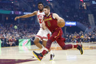 Cleveland Cavaliers' Kevin Love (0) drives on Chicago Bulls' Thaddeus Young (21) in the first half of an NBA basketball game, Saturday, Jan. 25, 2020, in Cleveland. (AP Photo/Ron Schwane)