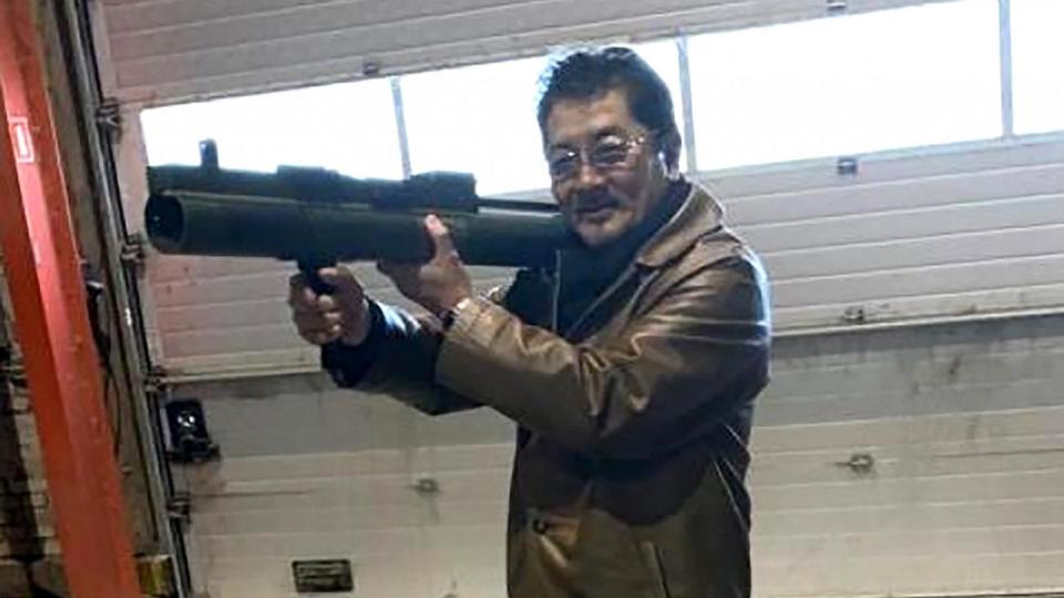 PHOTO: Takeshi Ebisawa is pictured handling a rocket launcher at a meeting with undercover agents, a 2022 criminal complaint shows. (U.S. Department of Justice)