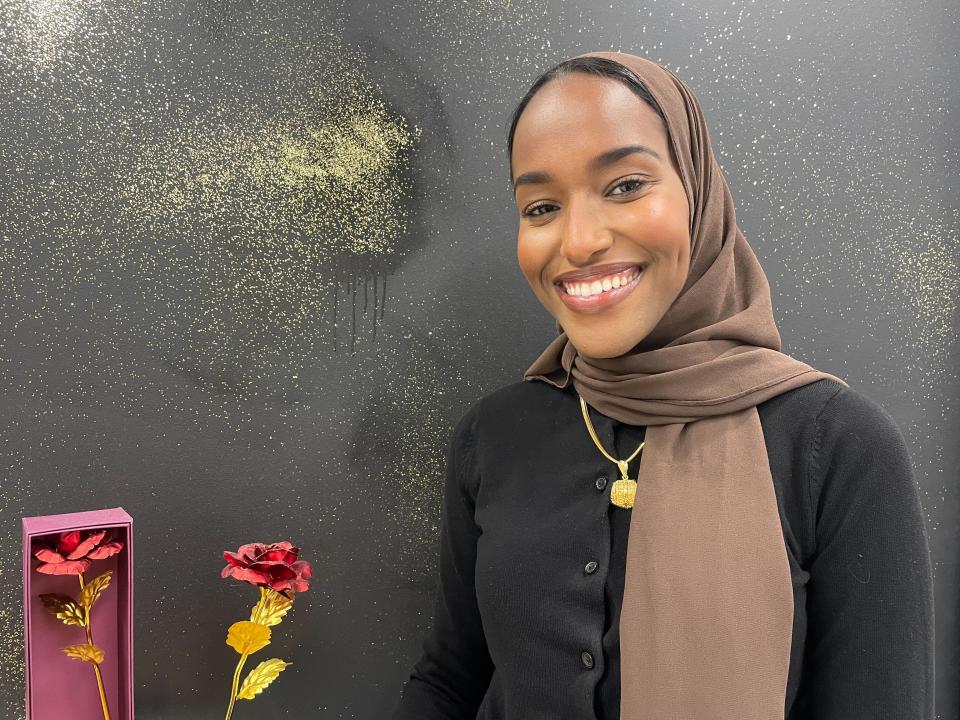 Zaynab Mohamed, who is in the first cohort of Black women senators ever elected to Minnesota's state Legislature, stands inside Midtown Global Market in Minneapolis, Minn., on Nov. 22, 2022, before joining the state's most diverse Legislature yet in January. (AP Photo/Trisha Ahmed)