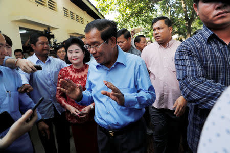 Cambodia's Prime Minister and President of the Cambodian People's Party (CPP) Hun Sen leaves after voting during a general election in Takhmao, Kandal province, Cambodia July 29, 2018. REUTERS/Darren Whiteside