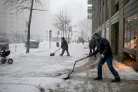 <p>Maintenance men shovel the sidewalks outside a building in the Flatiron District of New York during a winter storm, Feb. 9, 2017. A powerful, fast-moving storm swept through the northeastern U.S. Thursday, making for a slippery morning commute and leaving some residents bracing for blizzard conditions. (Photo: Gordon Donovan/Yahoo News) </p>