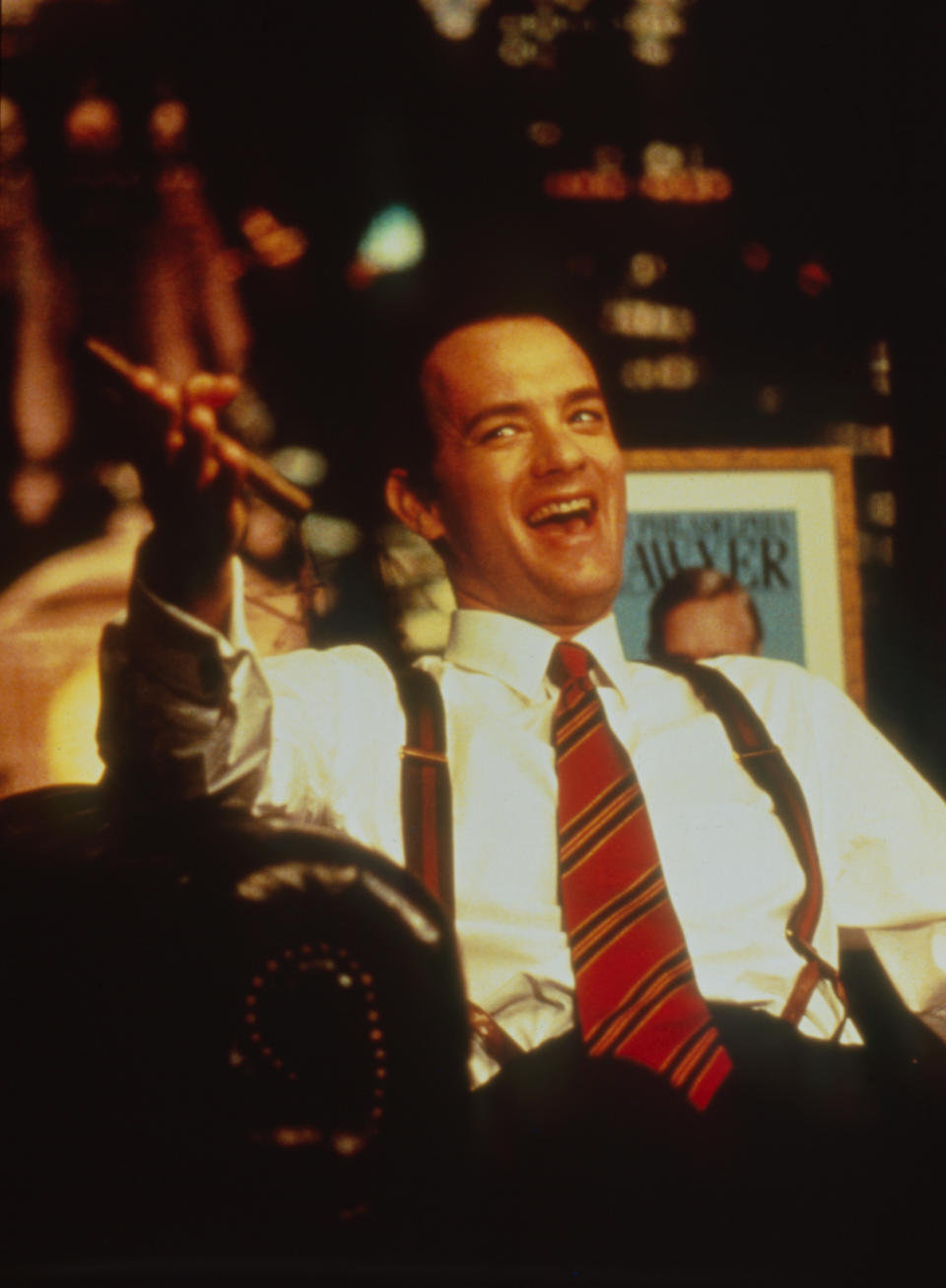 Tom Hanks smiling and pointing a cigar in "Philadelphia"