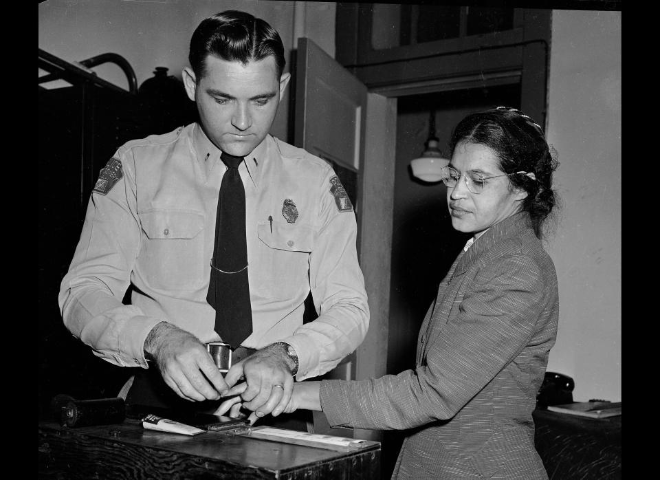 Rosa Parks, whose refusal to move to the back of a bus touched off the Montgomery bus boycott and the beginning of the civil rights movement, is fingerprinted by police Lt. D.H. Lackey in Montgomery, Ala., Feb. 22, 1956. She was among some 100 people charged with violating segregation laws. (Gene Herrick), AP Photo)