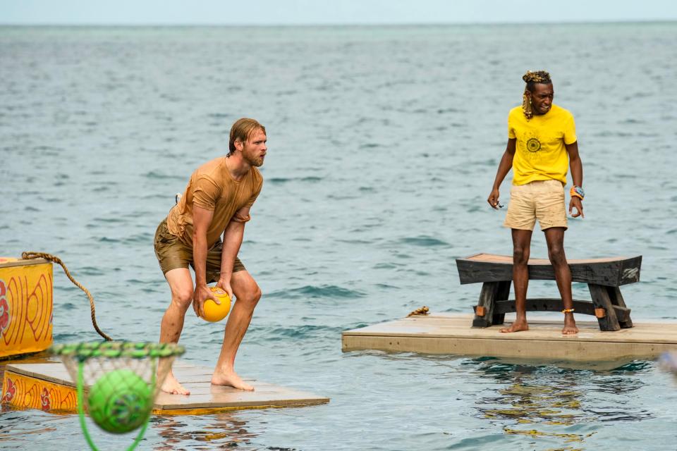 Hunter McKnight, left, a science teacher from French Camp, Miss., and Nami tribemate Tevin Davis compete on "Survivor" Season 46, which airs Wednesdays on CBS and streams on Paramount+.