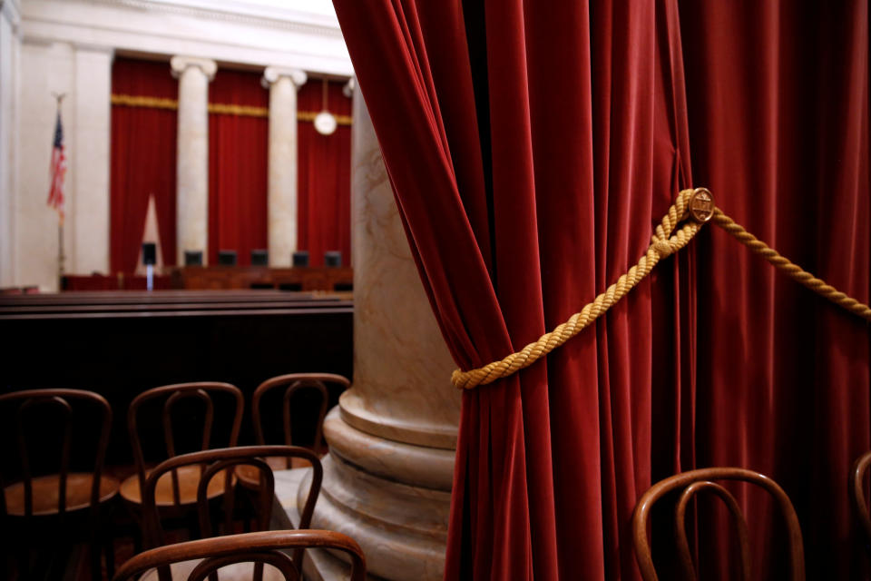 Red velvet drapes hang at the back of the courtroom at the U.S. Supreme Court building June 20, 2015.