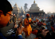 <p>A Hindu holy man, or sadhu, (C) sings and dances at the premises of Pashupatinath Temple on the eve of Shivaratri festival in Kathmandu, Nepal, Feb. 23, 2017. REUTERS/Navesh Chitrakar </p>