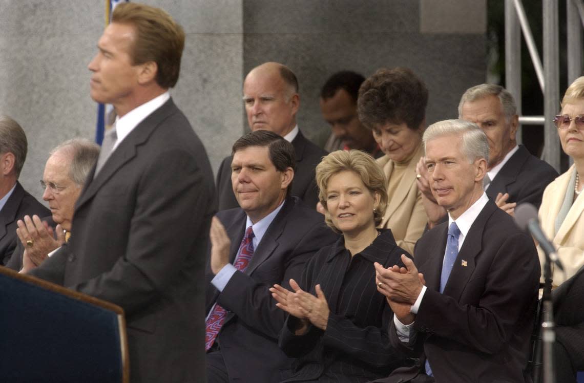 Arnold Schwarzenegger speaks after taking the oath of office for governor of California on the steps of the state Capitol on Nov. 17, 2003. Former Gov. Gray Davis and his wife Sharon look on at right. John Decker/Sacramento Bee Staff Photo
