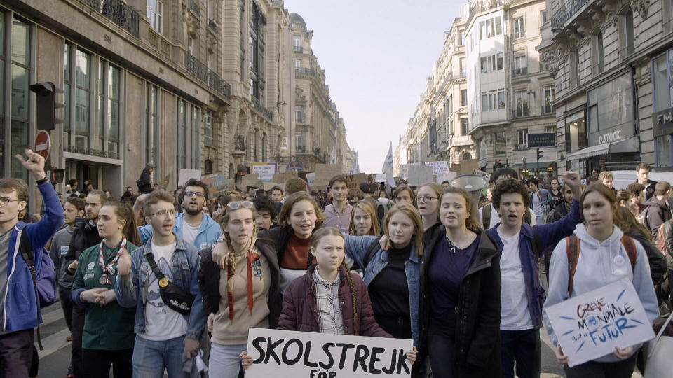 This image released by Hulu shows activist Greta Thunberg, center, in a scene from the documentary "I Am Greta." The film premieres Friday on Hulu. (Hulu via AP)