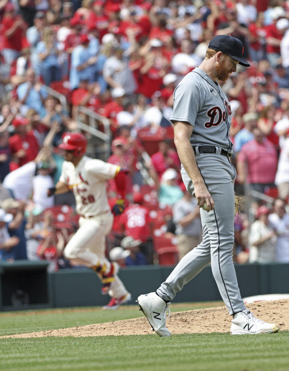 Detroit Tigers starting pitcher Spencer Turnbull, right, reacts as St. Louis Cardinals' Nolan Arenado, back left, circles the bases after hitting a two-run home run in the fifth inning of a baseball game, Saturday, May 6, 2023, in St. Louis. (AP Photo/Tom Gannam)