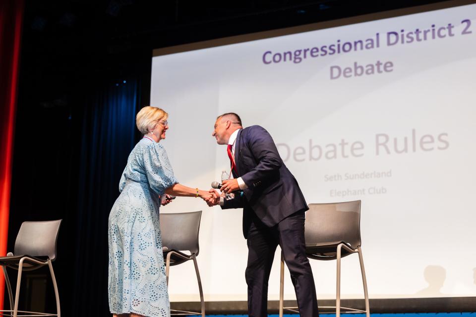 Greg Hughes shakes the hand of Becky Edwards during the first Congressional District 2 debate at Woods Cross High School in Woods Cross on June 20, 2023. | Ryan Sun, Deseret News