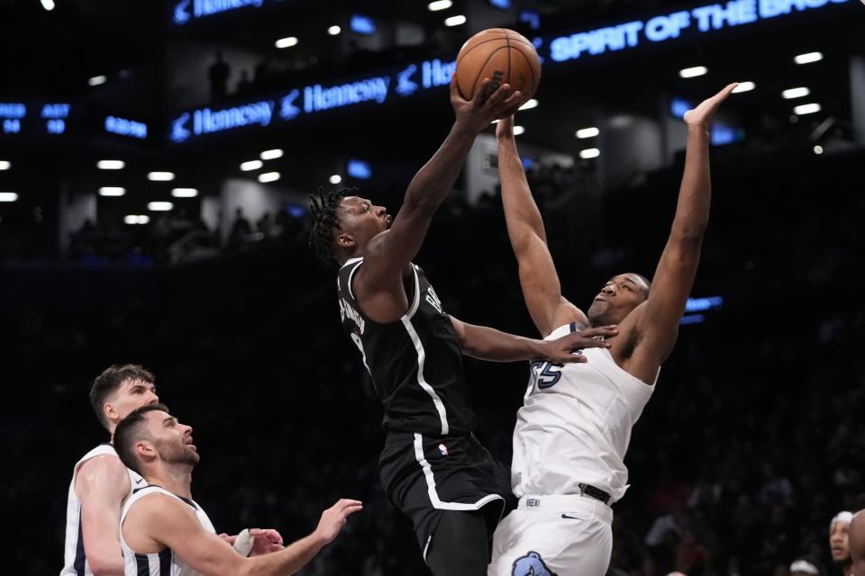 Brooklyn Nets' Dorian Finney-Smith shoots over Memphis Grizzlies' Trey Jemison during the first half of an NBA basketball game, Monday, March 4, 2024, in New York. (AP Photo/Frank Franklin II)